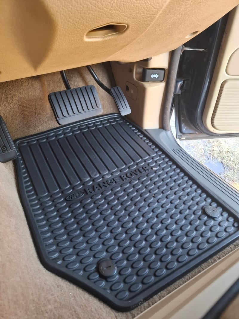 Range Rover driver footwell after detailing — clean, refreshed rubber mat, Johannesburg North