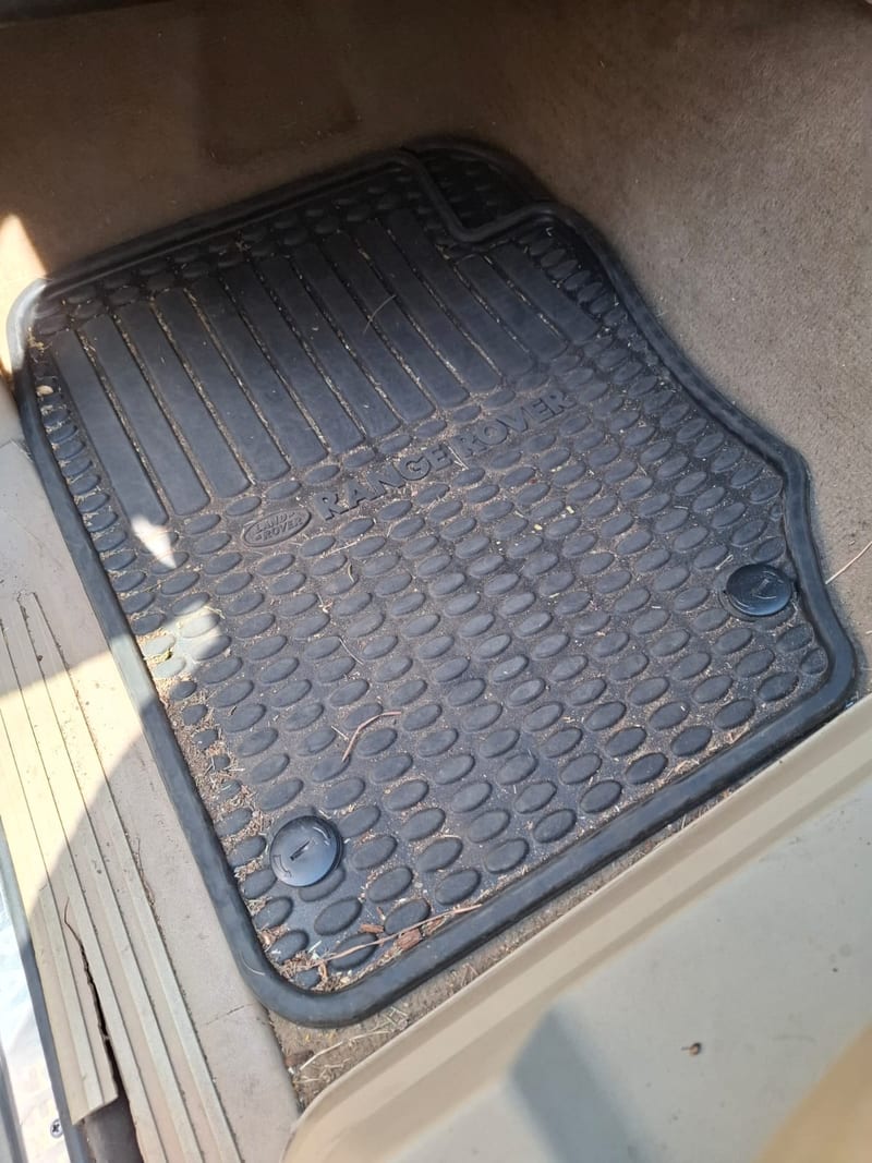 Range Rover floor mat before detailing — dusty and soiled, Johannesburg North